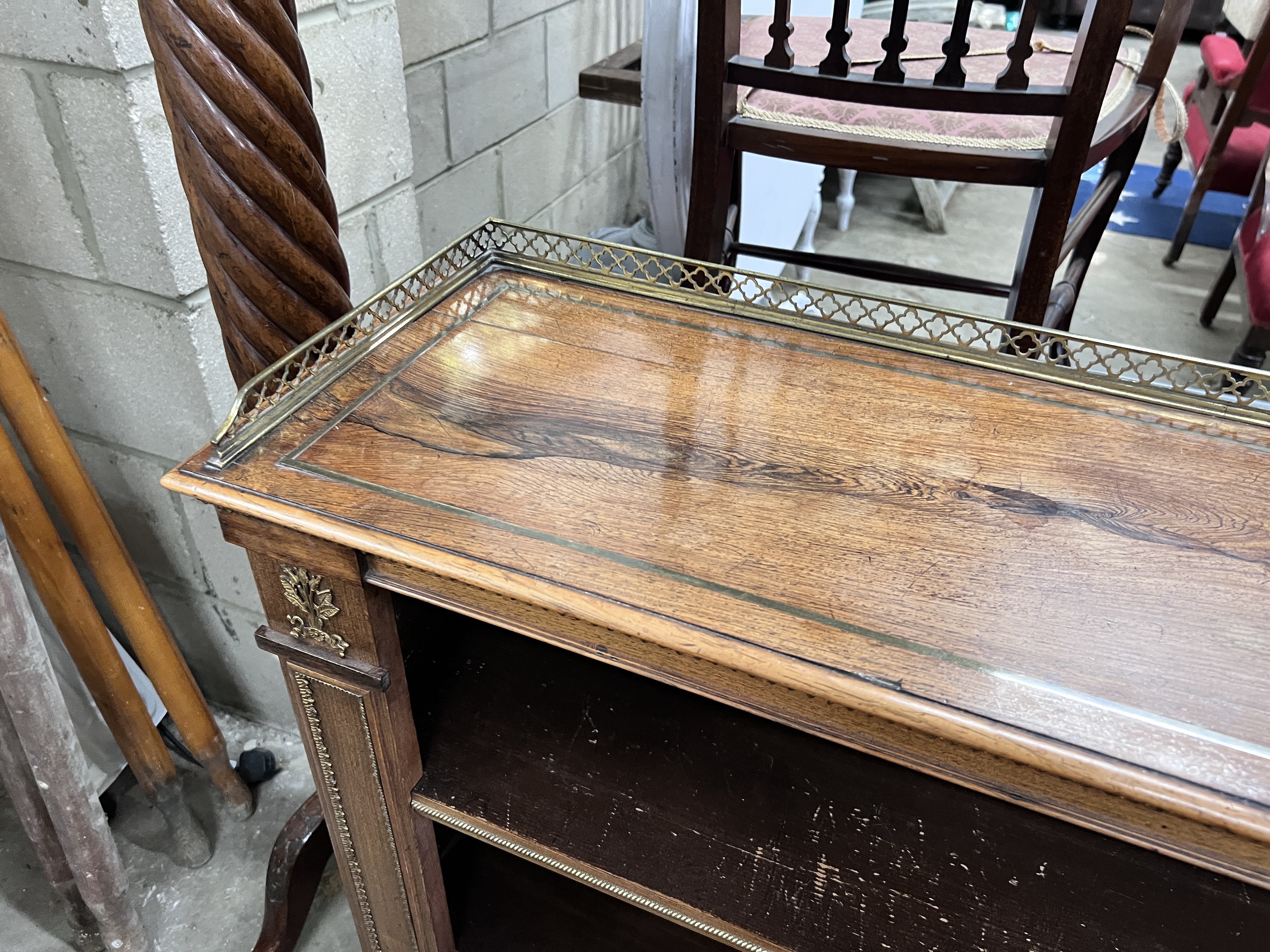 A Regency style giltwood metal mounted rosewood open bookcase, width 111cm, depth 30cm, height 90cm